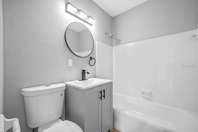 4445 Stuart Ave, Titusville, FL 32780 - full bath with tub / shower combination, toilet, a textured wall, and vanity