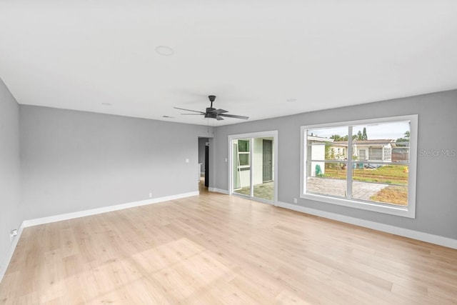 4445 Stuart Ave, Titusville, FL 32780 - unfurnished room featuring light wood-type flooring, baseboards, and ceiling fan