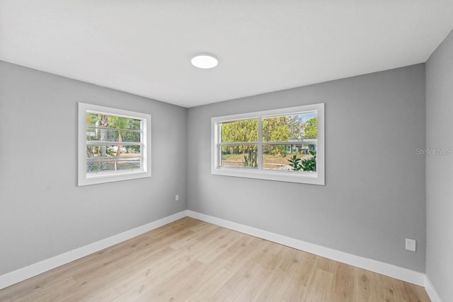 4445 Stuart Ave, Titusville, FL 32780 - spare room featuring baseboards and wood finished floors