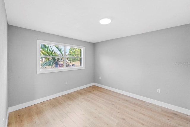 4445 Stuart Ave, Titusville, FL 32780 - empty room featuring wood finished floors and baseboards