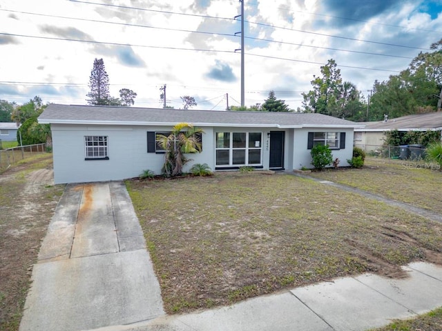 4445 Stuart Ave, Titusville, FL 32780 - ranch-style house featuring driveway