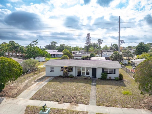 4445 Stuart Ave, Titusville, FL 32780 - ranch-style house featuring driveway and stucco siding