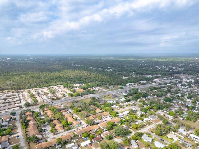 4445 Stuart Ave, Titusville, FL 32780 - aerial overview of property's location with a heavily wooded area and nearby suburban area