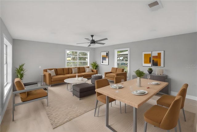 4445 Stuart Ave, Titusville, FL 32780 - living area featuring ceiling fan, baseboards, and light wood-style flooring