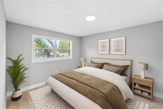4445 Stuart Ave, Titusville, FL 32780 - bedroom featuring baseboards and light wood finished floors