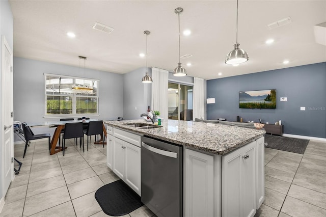 kitchen with stainless steel dishwasher, a sink, light tile patterned floors, an island with sink, and recessed lighting
