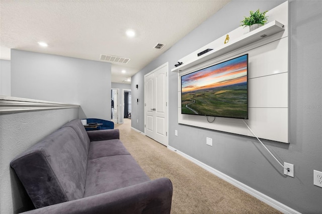 carpeted cinema with baseboards, recessed lighting, and a textured ceiling