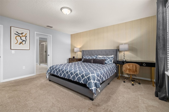 carpeted bedroom with baseboards and a textured ceiling