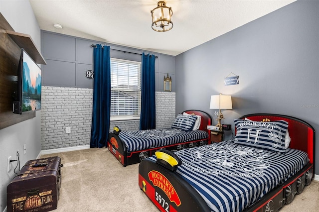 bedroom with carpet and baseboards