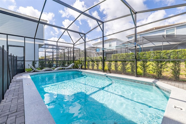 swimming pool featuring a lanai and a patio