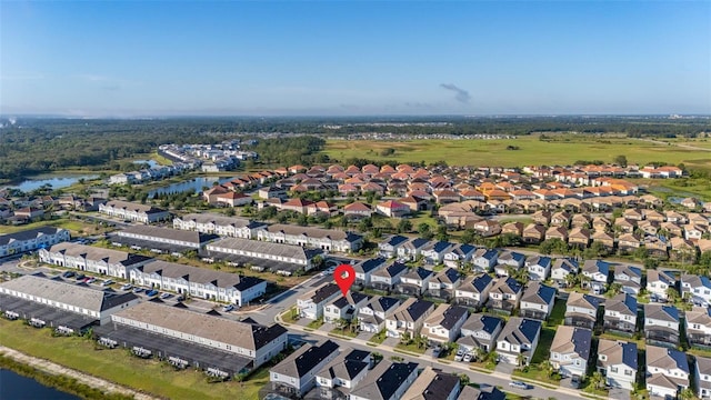 view of property location with a large body of water and nearby suburban area