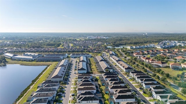 aerial overview of property's location featuring nearby suburban area and a large body of water