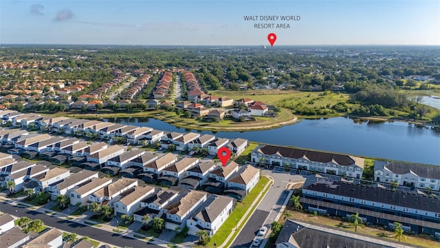 aerial overview of property's location with a large body of water and nearby suburban area