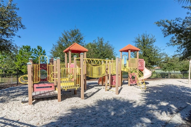 community jungle gym featuring fence