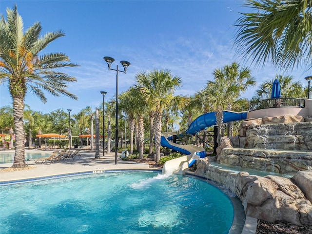 community pool with a water slide