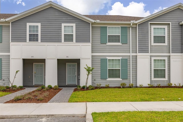 view of property with a front lawn