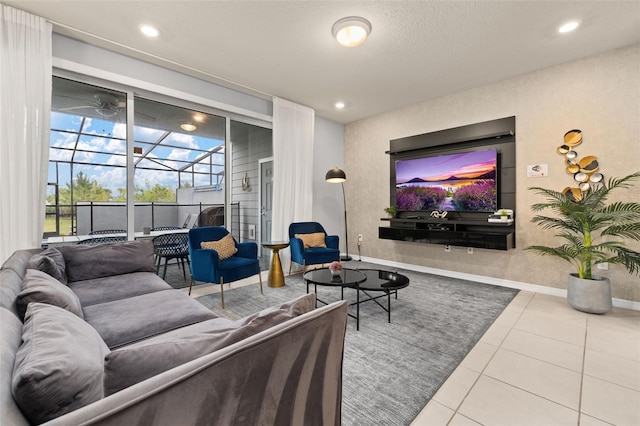 tiled living area featuring a sunroom, recessed lighting, baseboards, and ceiling fan