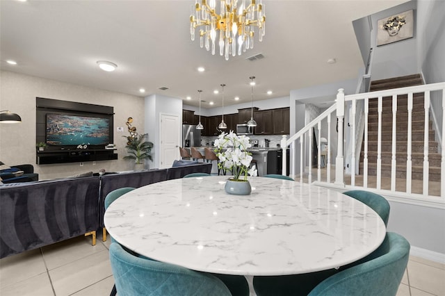 dining space with light tile patterned floors, stairs, a chandelier, recessed lighting, and baseboards