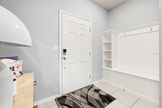 mudroom featuring light tile patterned floors and baseboards