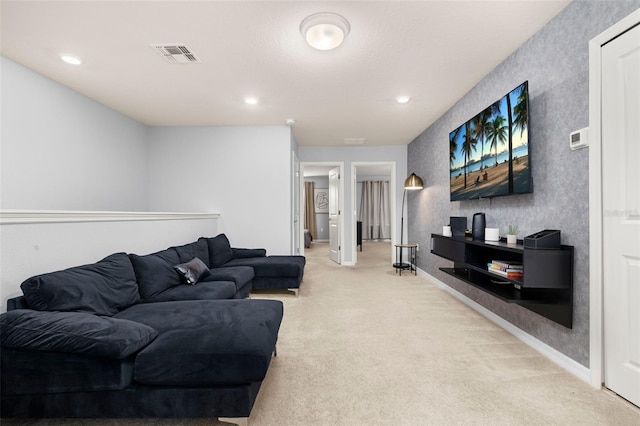 living area with light colored carpet, recessed lighting, and baseboards