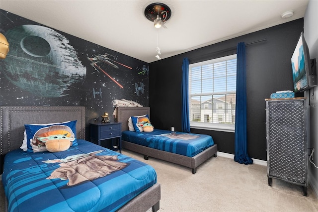 carpeted bedroom featuring baseboards