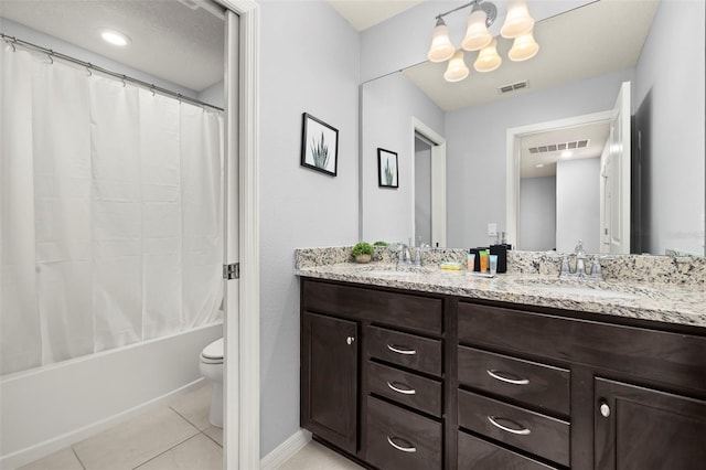 full bathroom featuring tile patterned floors, double vanity, toilet, shower / bath combo, and baseboards