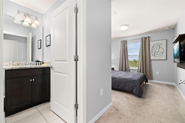 bathroom featuring baseboards and vanity