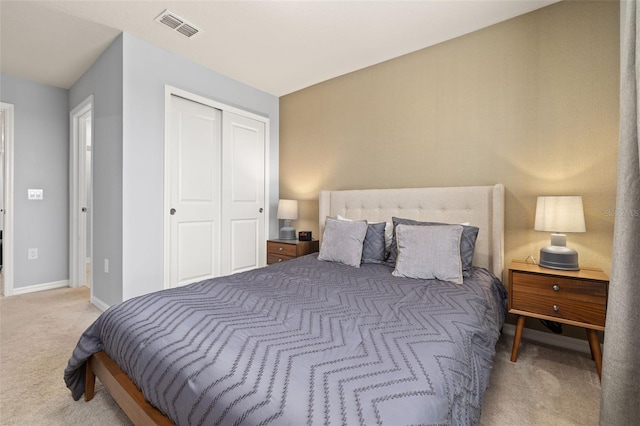 bedroom featuring carpet flooring, a closet, and baseboards