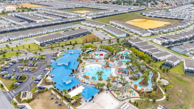 aerial view of property and surrounding area with a pool area