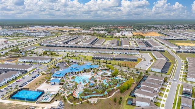 aerial view of property and surrounding area with a pool