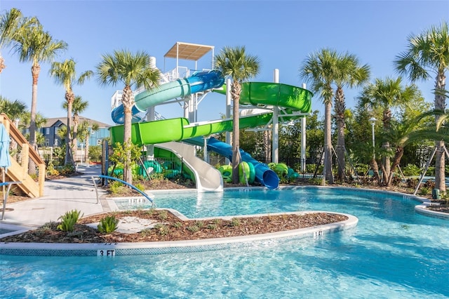 community pool with a water slide