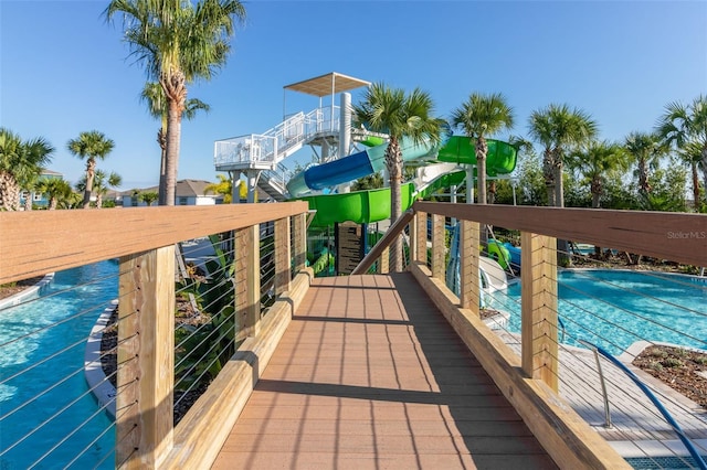 deck featuring a community pool
