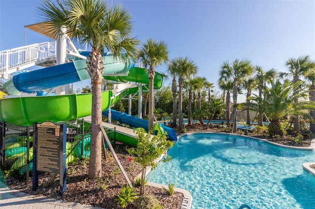 community pool with a water slide