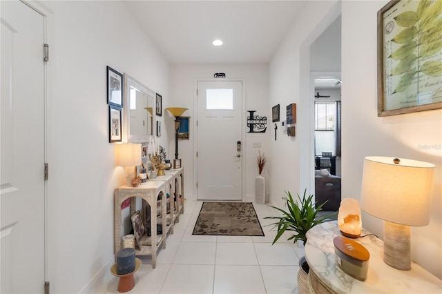 entrance foyer with light tile patterned floors, recessed lighting, and baseboards
