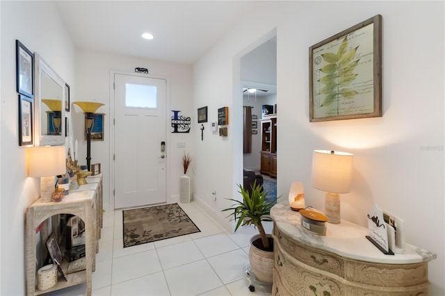 entryway featuring light tile patterned flooring and recessed lighting