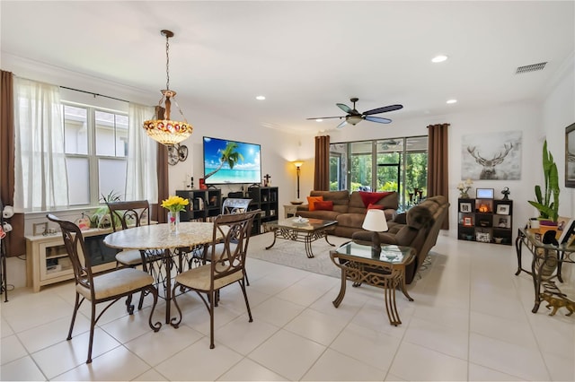 dining space with ceiling fan and recessed lighting