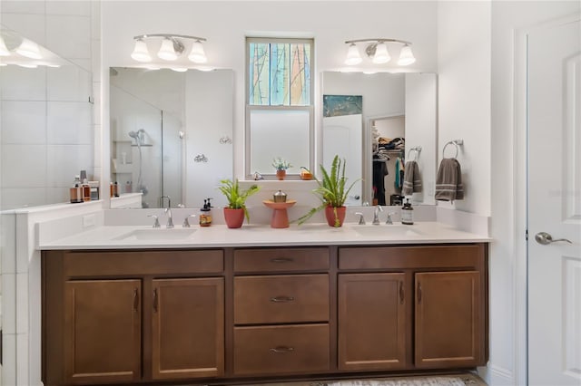 full bath featuring a stall shower and double vanity