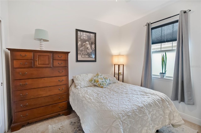 bedroom featuring baseboards