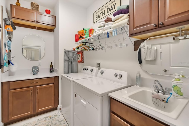 washroom with independent washer and dryer and cabinet space