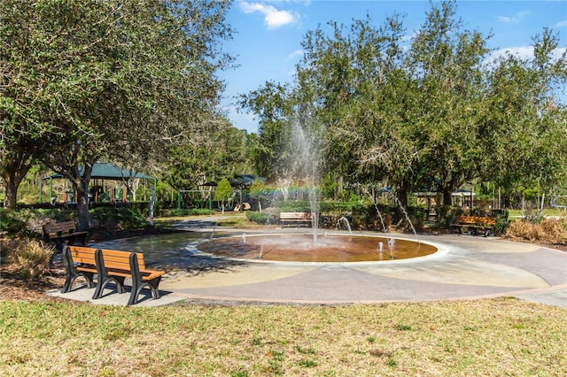 view of home's community with a gazebo and curved driveway