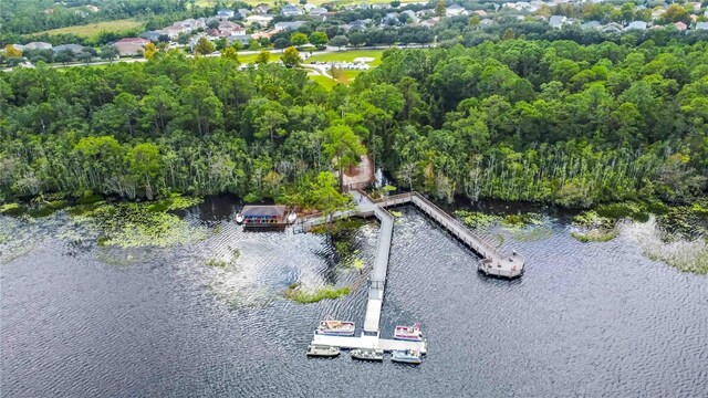 aerial view of a nearby body of water and a heavily wooded area