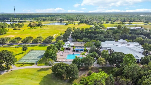 aerial view of a nearby body of water, a pool, and a golf club