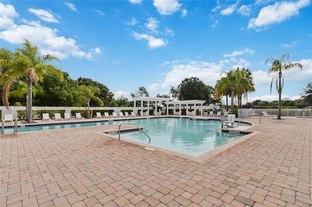 3378 Sagebrush St, Harmony, FL 34773 - community pool with a pergola, a jacuzzi, fence, and a patio area