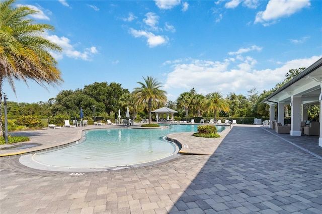 3378 Sagebrush St, Harmony, FL 34773 - community pool with a gazebo, a patio area, and view of scattered trees