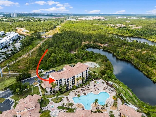 bird's eye view featuring a water view and a wooded view