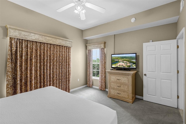 bedroom featuring baseboards, a ceiling fan, and carpet