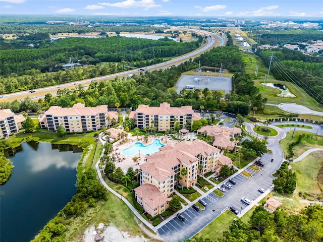 bird's eye view of a large body of water and a pool area