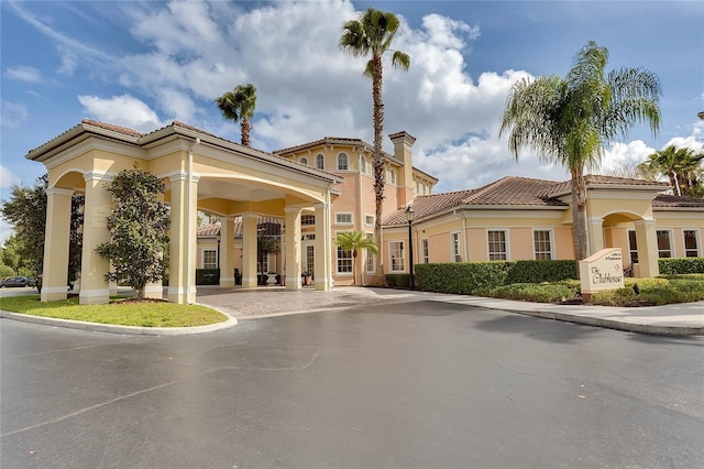 view of property with curved driveway
