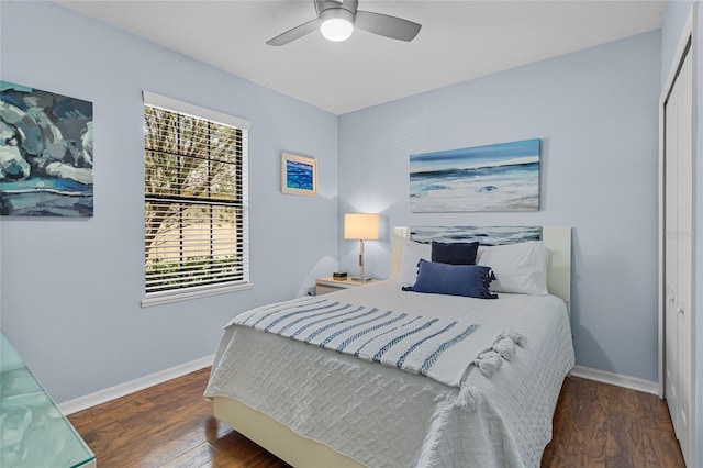 bedroom with baseboards, wood finished floors, and ceiling fan