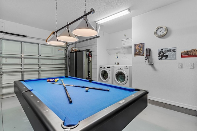 recreation room with independent washer and dryer, baseboards, concrete flooring, billiards, and a textured ceiling